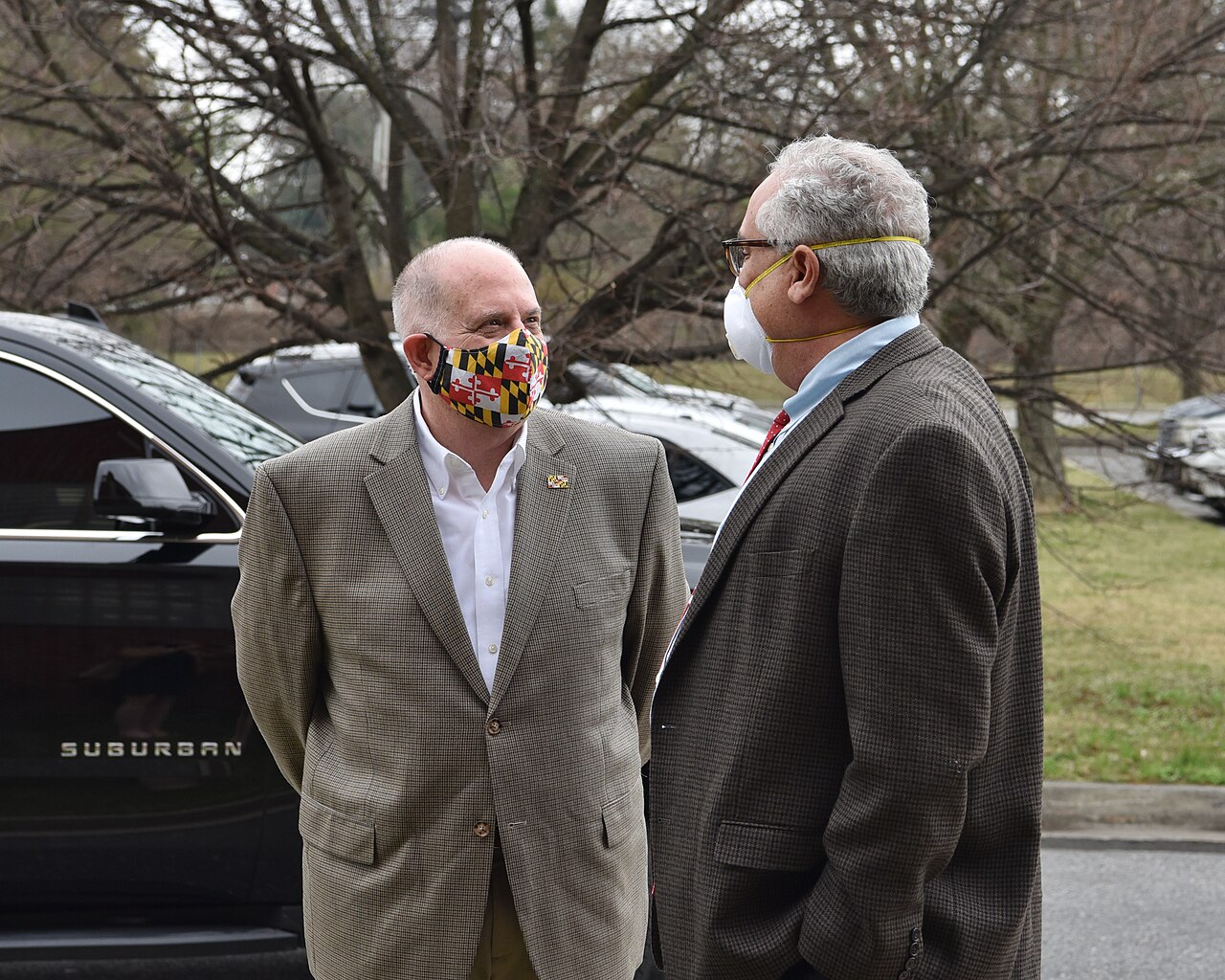 Older adult receiving a COVID-19 vaccine from a healthcare worker