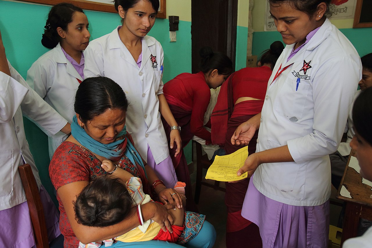 Child receiving measles vaccination at a public health clinic