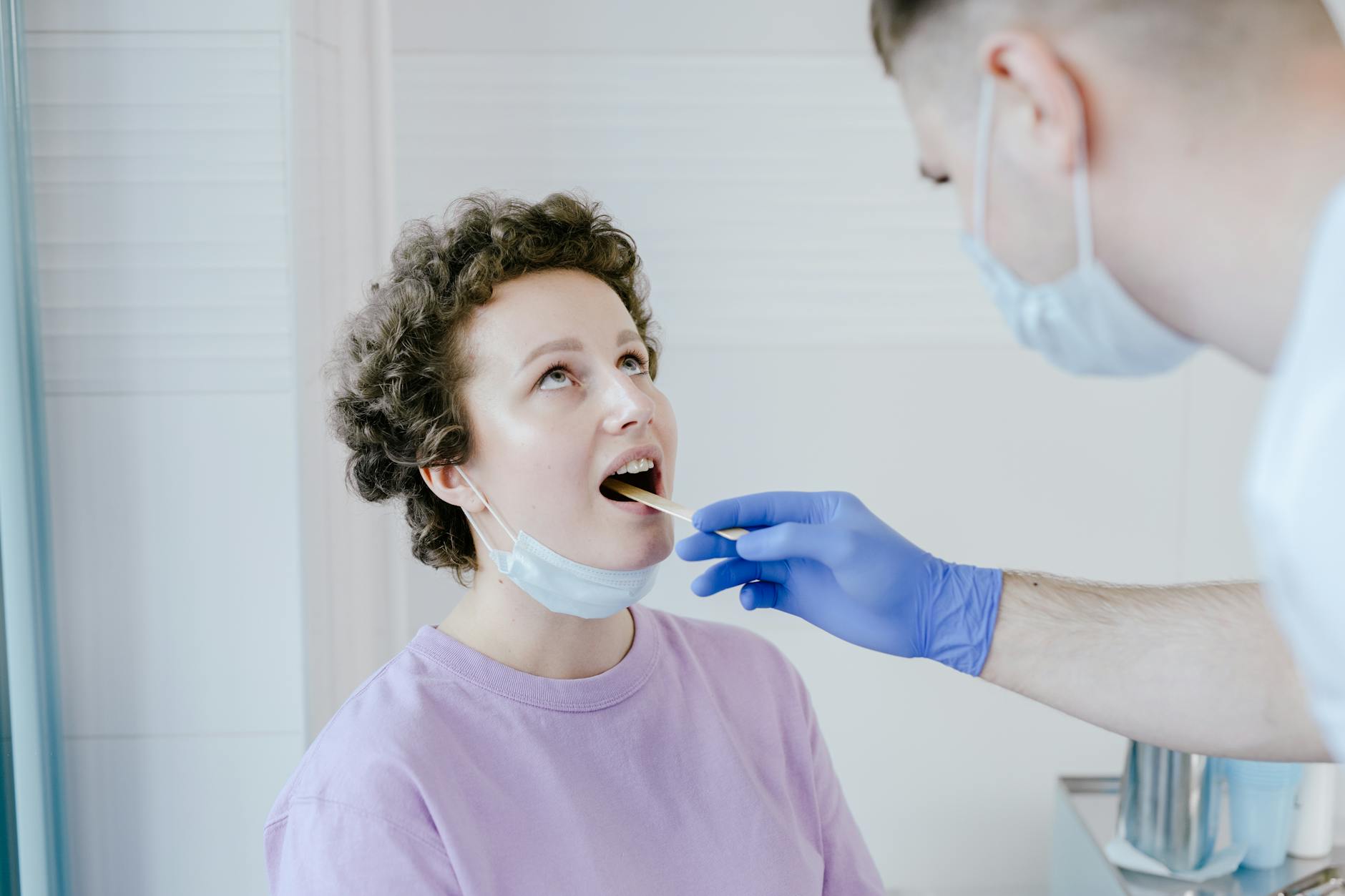 Healthcare worker reviewing patient chart in a long COVID clinic