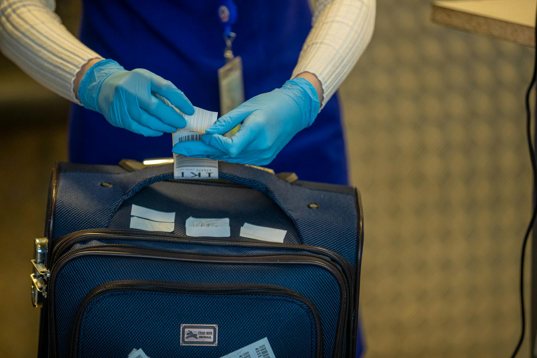 Travellers at an international airport health screening checkpoint